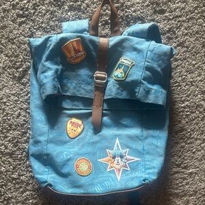 Disneyland Blue Backpack with Disney patches.